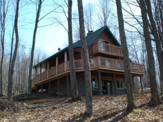 Front view of Golf Cabin facing the 14th and 15th fairways of the Wilderness Valley Golf Course in Gaylord Michigan.